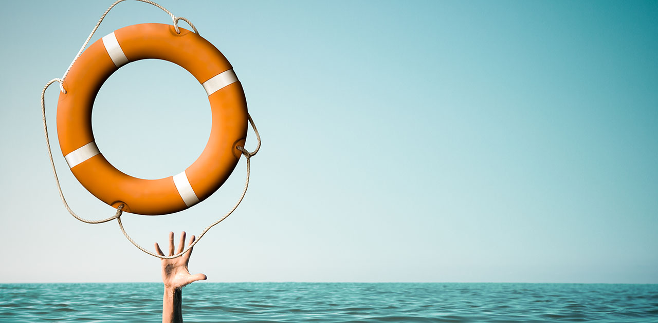 Drown man with rised hand getting lifebuoy help in sea or ocean